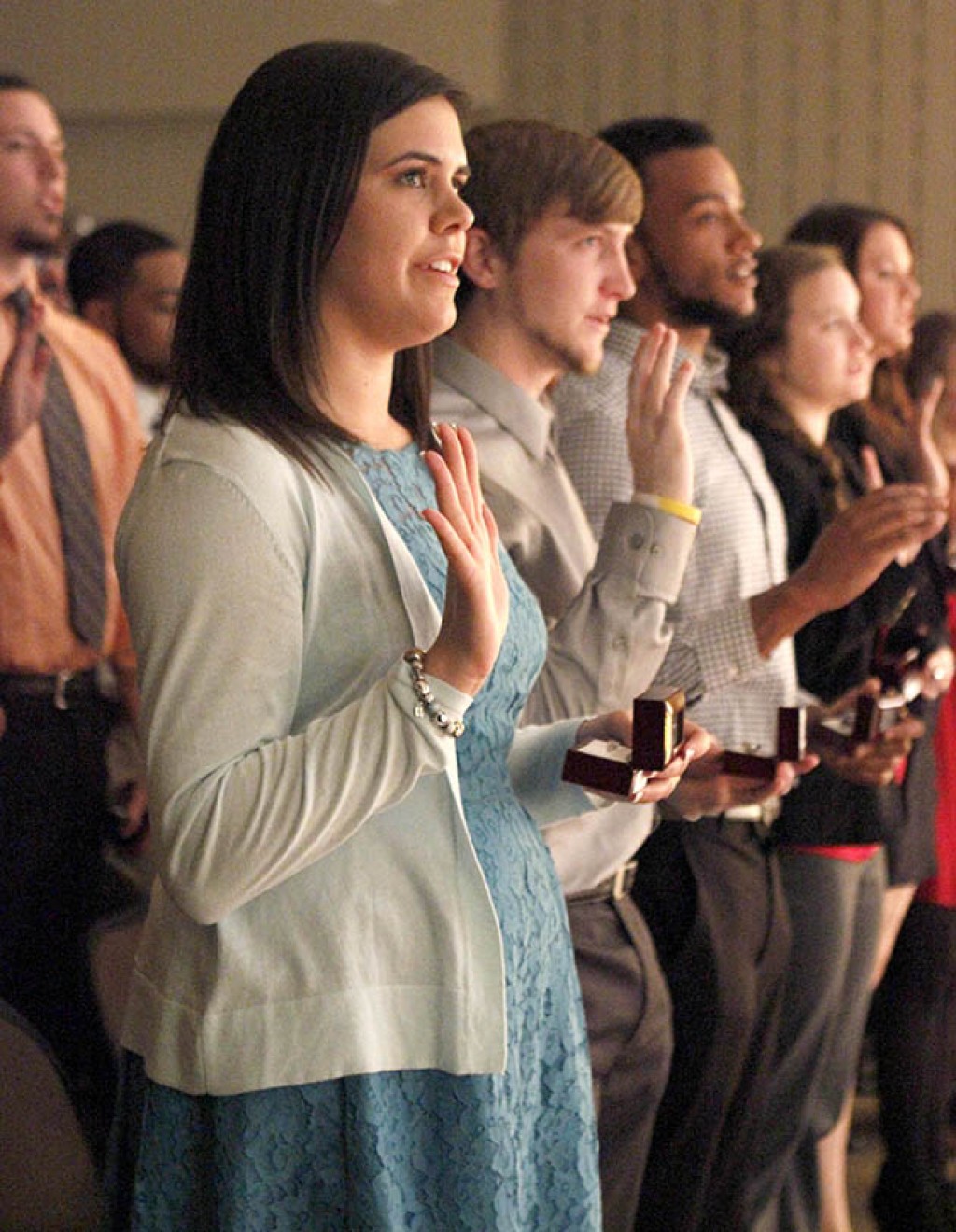 Students accepting their class ring