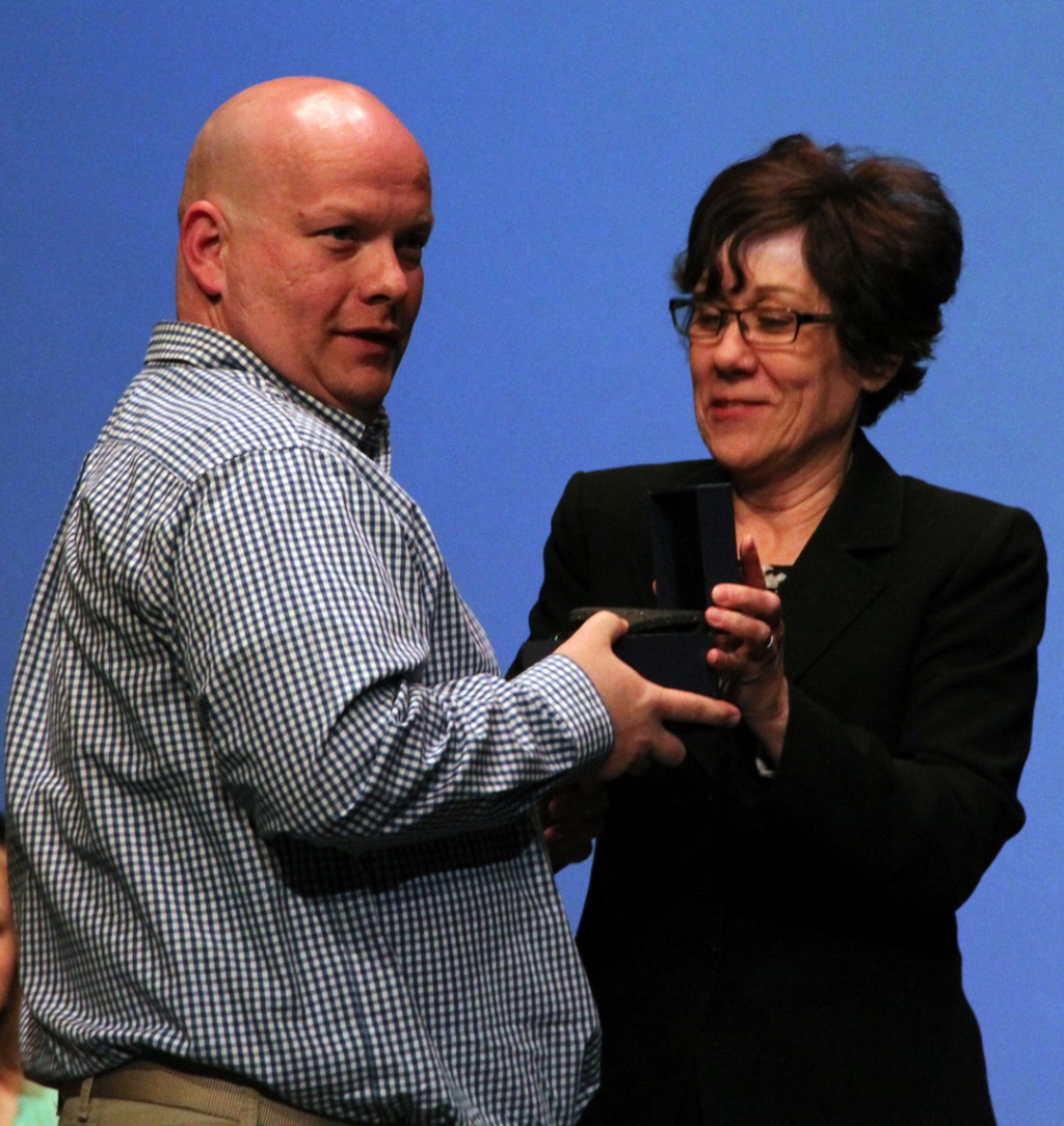 Computer Information Systems professor William Hilliker is presented the Outstanding Faculty award by Grace Yackee, vice president of instruction.